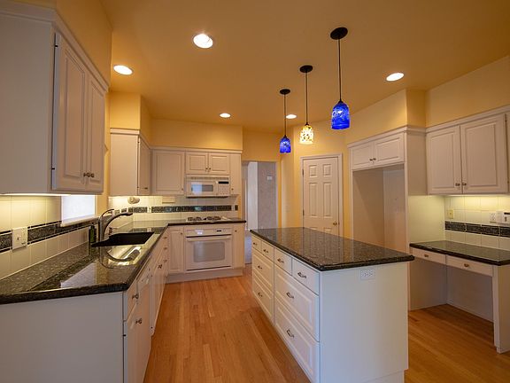 Kitchen with beautiful countertops, farm sink, Bosch dishwas