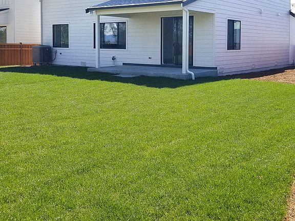 Fenced rear yard and covered patio