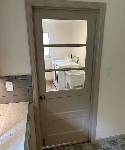 Door from kitchen to mud room/laundry.