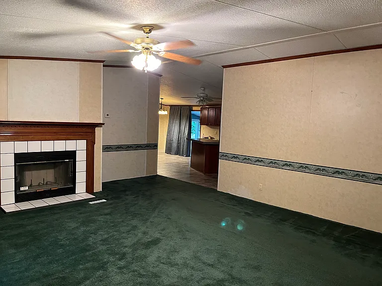 Entry into the front living room from the front door and leads in to the Master Bedroom and the kitchen!