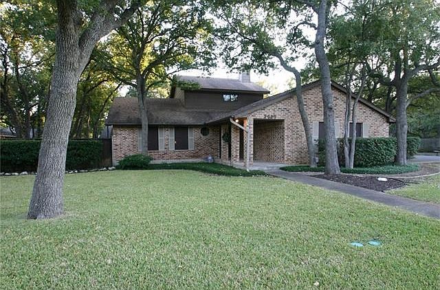 Well maintained 4/2/2 nestled among towering trees in the desirable Shady Hollow subdivision.