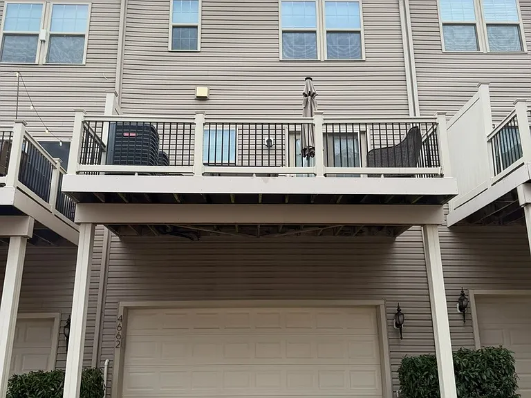 Back deck and covered parking and garage for multiple vehicles