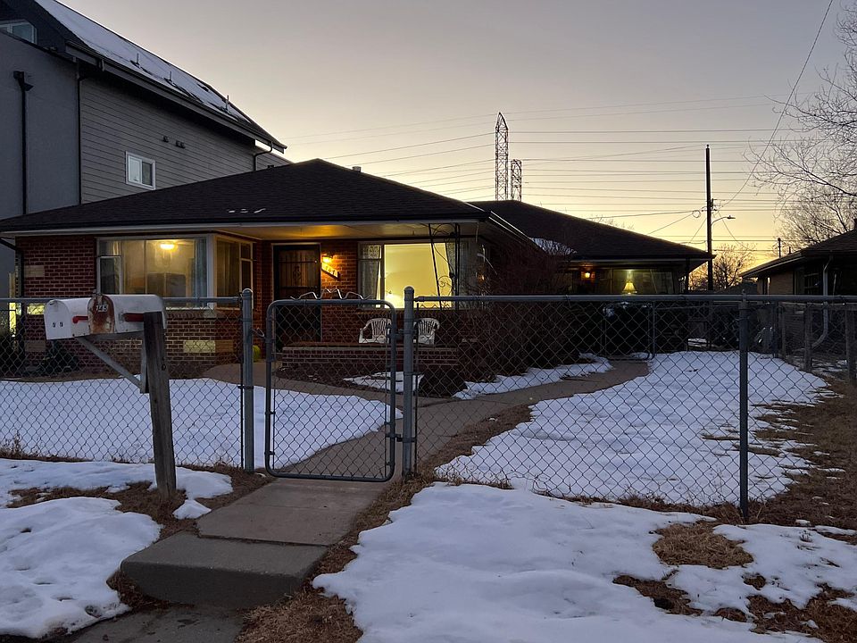 Fenced front yard. Common sidewalk to back half of duplex.