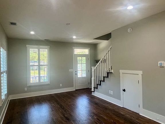 Main living area. Plantation shutters & hardwood floors throughout home
