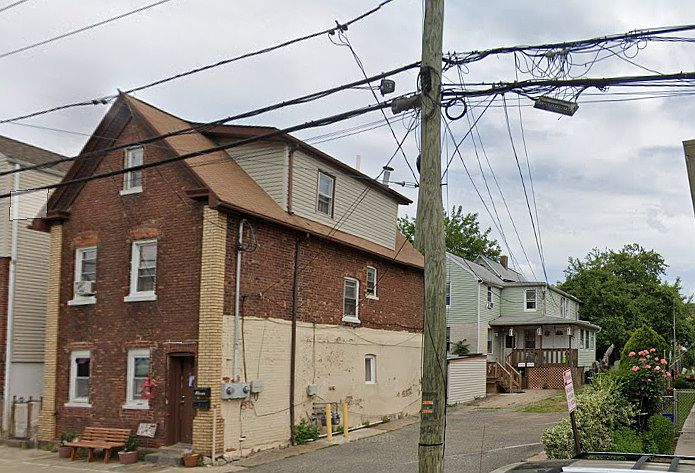 Apartment is located in the rear house on the first floor.