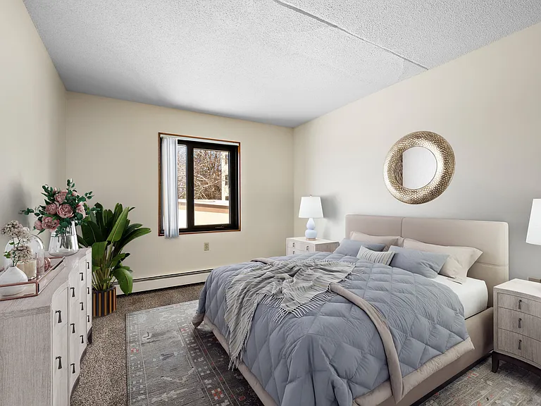 Welcome to Chardon Court Apartments, where style meets comfort. This beautiful bedroom features natural light, elegant decor, and cozy furnishings, perfect for relaxation. Schedule your tour today and make this space your own!