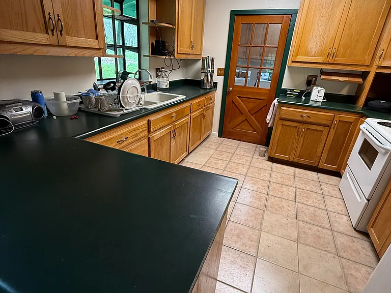 Large kitchen with plenty of storage. No dishwasher.