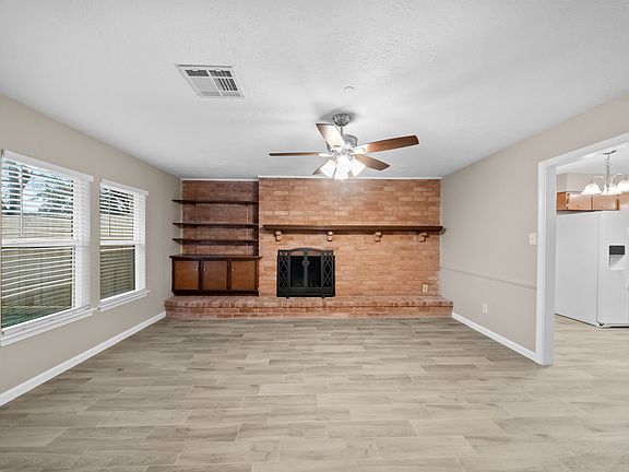 Fireplace and bookcase.