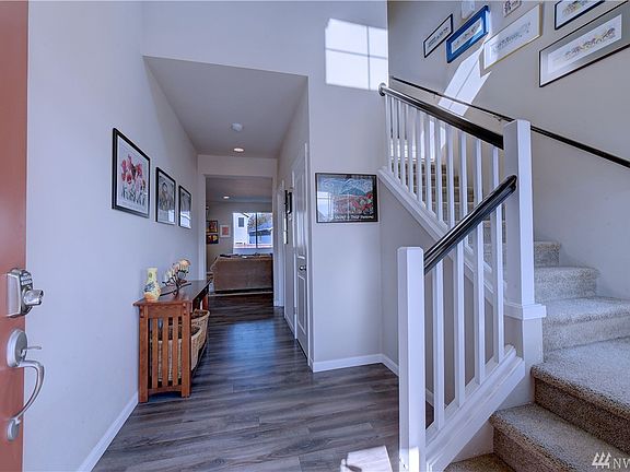 View from front door entry, nice wide walkway leading to the living area! Stairs lead up to the loft and 3 bedrooms! 
