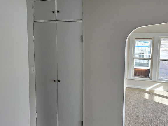 Looking towards living room and entry closet.