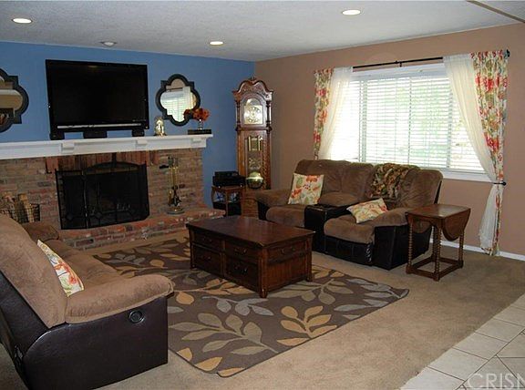 Living Room with Woodburning Fireplace