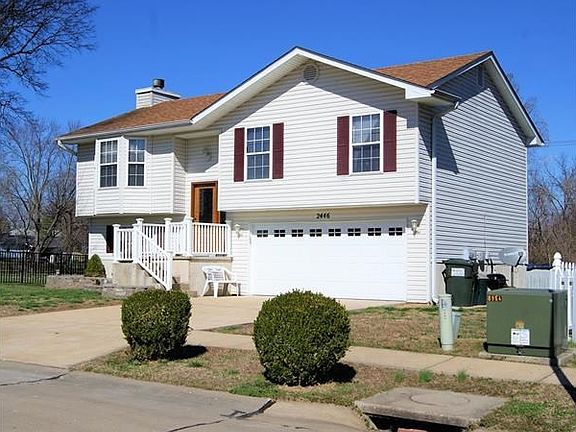 New Garage Door, vinyl railing, closed in soffits and facia, fireplace, shutters, beautifully landscaped and street lights