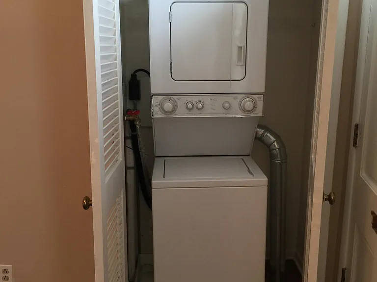 Washer and dryer in closet in kitchen