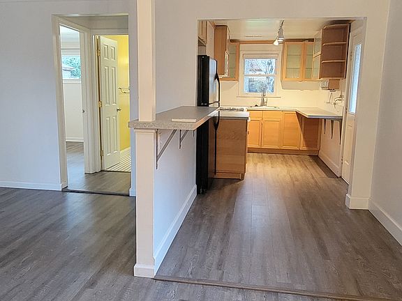 From the eating area you see the kitchen on the left , the bathroom is where the yellow glow is, and the 2nd bedroom is the door to the left of the bathroom.