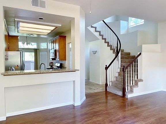 Kitchen includes eating nook. Appliances include a newly installed fridge.