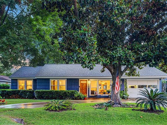 Circular drive for easy entry with an over sized single garage that could accommodate a couple of Coopers and still have work space. But you won't need to use your garage for a workspace...you will see what the back yard holds!