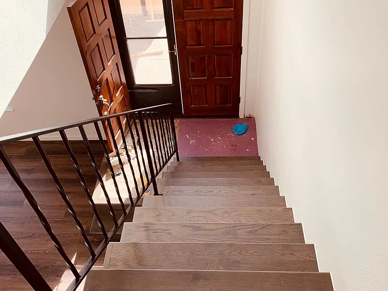 Stairs to the main level and front door