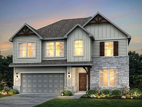 Exterior L, with covered front porch, stone accents, and a 2-car garage