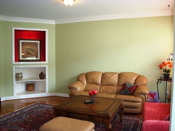Bright and spacious living room with custom built-ins