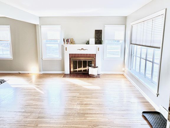 Large living room and fireplace. Lots of light!