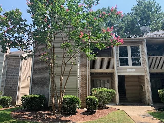 View from the parking lot, lower left condo, all first floor