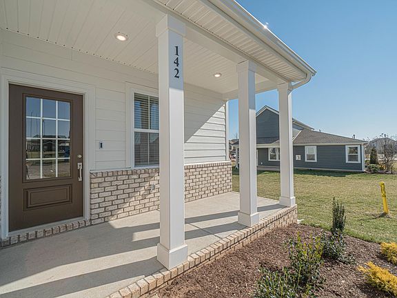 Quaint front porch for sitting area