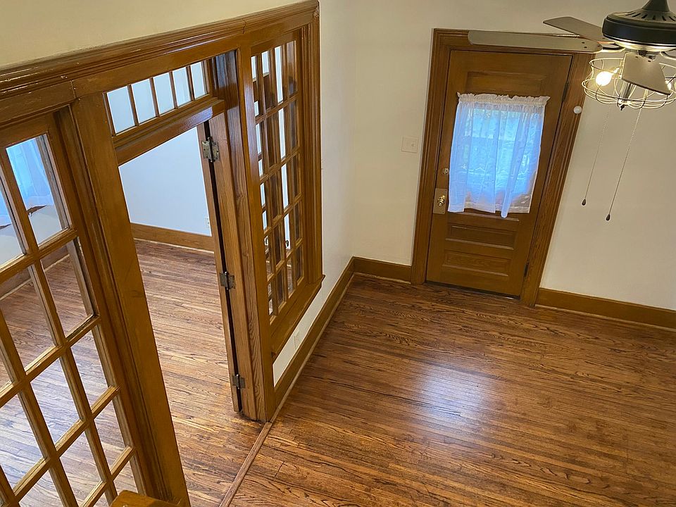 Front door, foyer, and sunroom