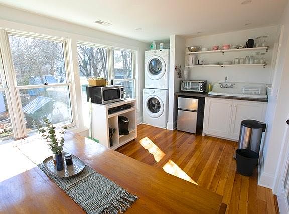 Kitchenette with dining table area and laundry.