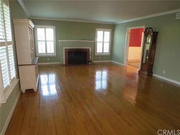 Living room with fireplace and hardwood floors