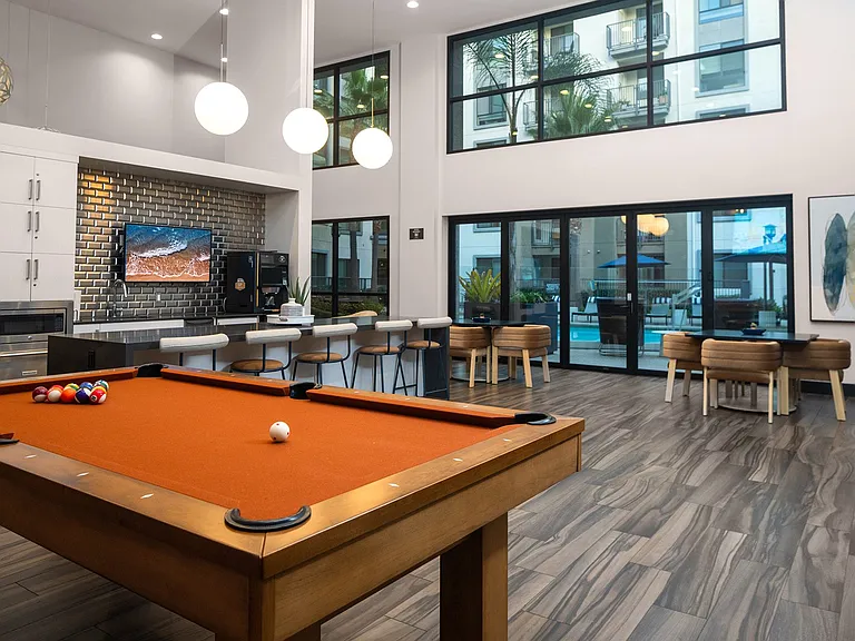 Newly renovated clubhouse with seating, coffee, and billiards table