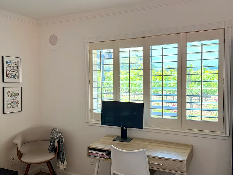 2nd bedroom with views over the vineyard to pond on neighboring property.