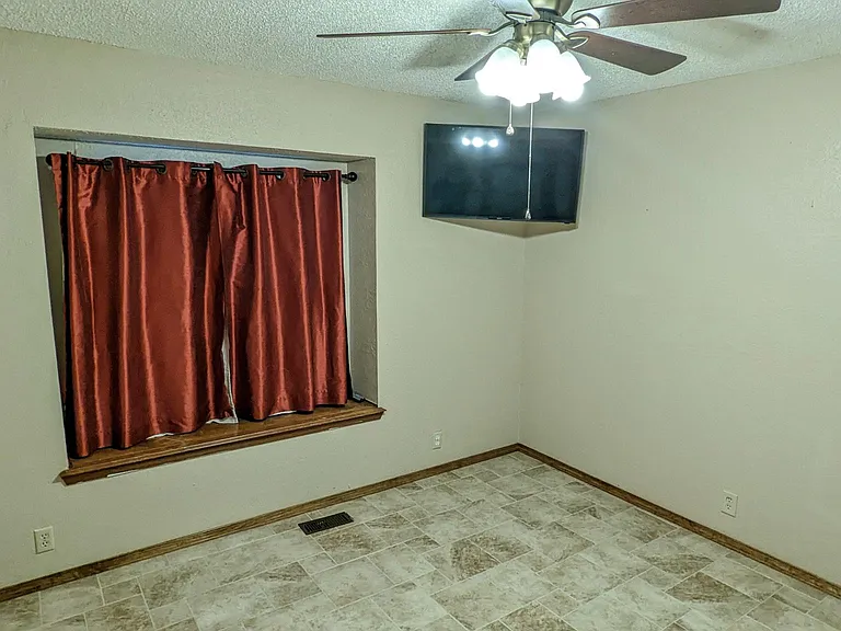 Tile floors, triple-pane, double hung, windows make this home peaceful and quiet. Mounted TV.