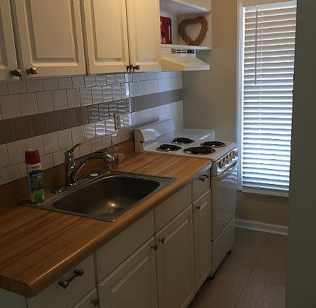 Galley Kitchen with full size refrigerator