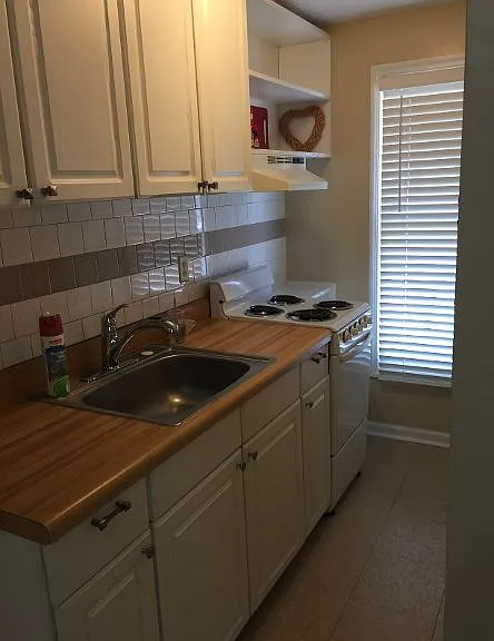 Galley Kitchen with full size refrigerator