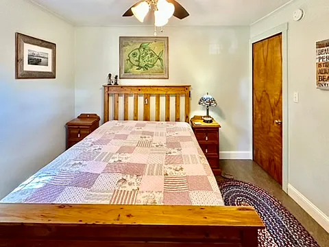 This room features a queen bed with a new supportive eco mattress. The recycled pine timber frame is imported from Australia. Featured oil painting is from Cuba.
