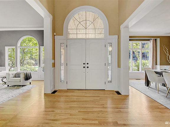 Oversized windows surround the entire home. >