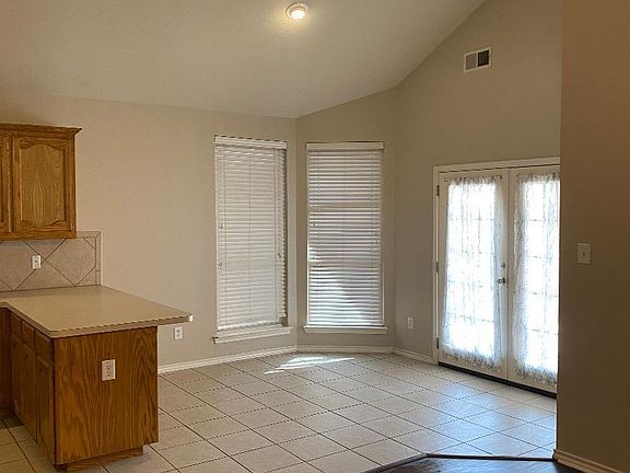Dining area with large windows.