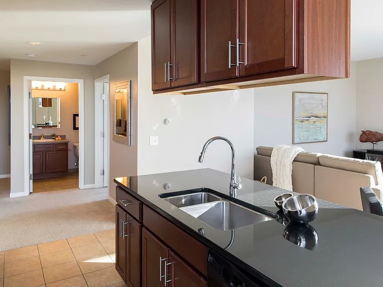 Our open-concept layouts make entertaining effortless, blending kitchen and living spaces for a warm, inviting atmosphere.