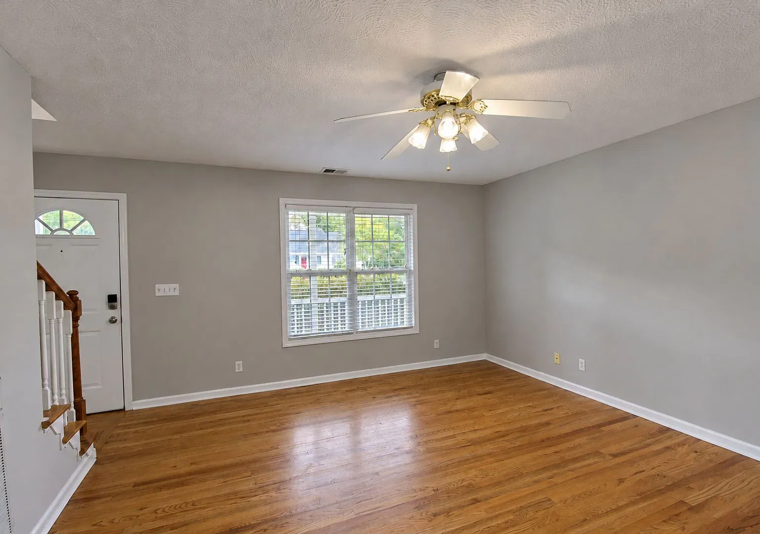 3-Bedroom Home with Main-Level Primary Suite, Sunroom & 2-Car Garage — Photo 2