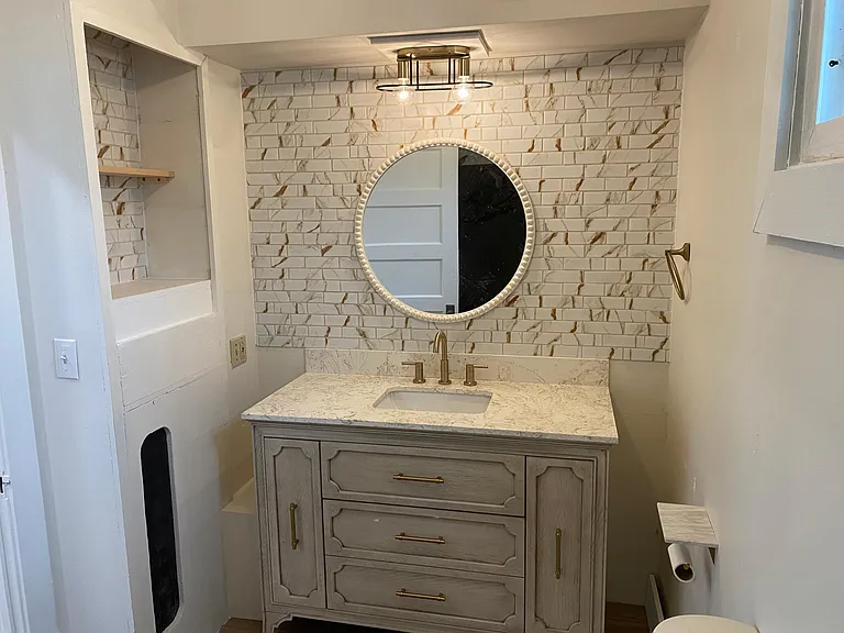 Bathroom- vanity, toilet, tub/shower