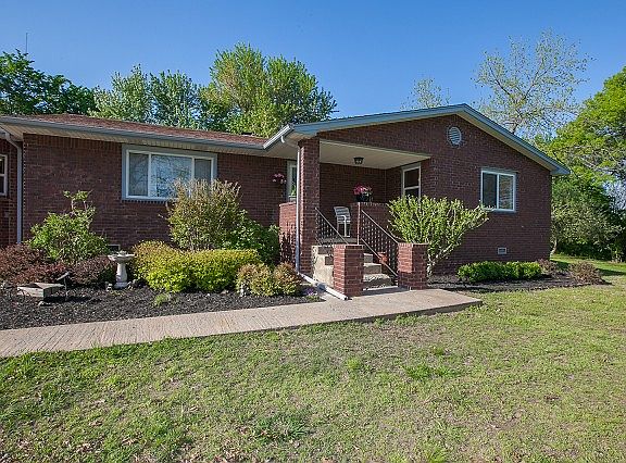 Full brick front facade with relaxing front porch.