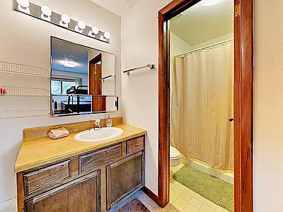 En-suite bathroom to front room with the bunk beds.