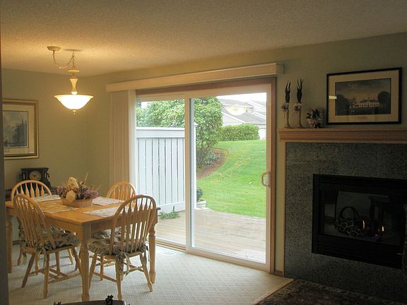 Gas log mantled fireplace with marble surround