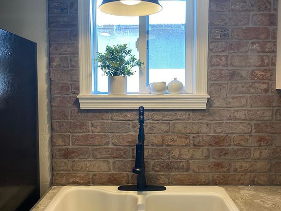 Exposed brick backsplash