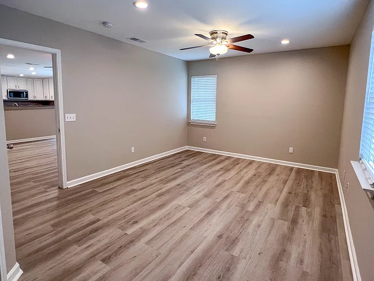 Primary bedroom located just off the main living area and thoughtfully separated from the secondary bedrooms for added privacy.