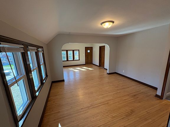 dining room and living room photographed from kitchen entry