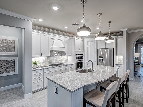 Model Representation; Kitchen with stainless appliances & quartz countertops