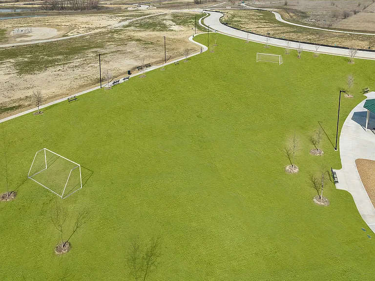 There is a soccer field with goals.