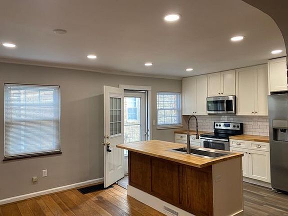 New stainless appliances, dishwasher underneath island countertop!