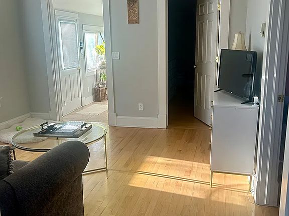 Living Room facing front bedroom and front door - hallway